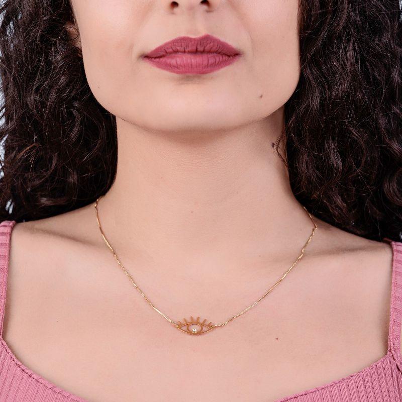 GARGANTILHA OLHO GREGO COM CILIOS E UMA MINI PEDRINHA DE ZIRCONIA