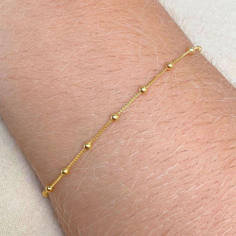 PULSEIRA COM 15 MINI BOLINHAS COM ESPAÇO ENTRE ELAS