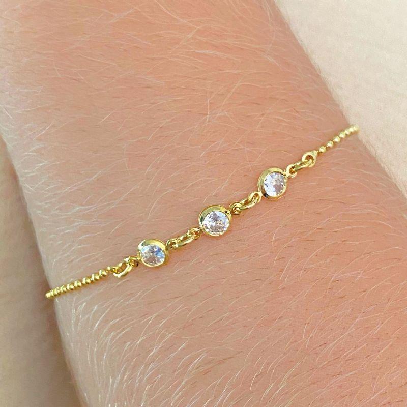 PULSEIRA CORRENTE COM MINI BOLINHAS E 3 ZIRCONIAS CRAVEJADAS AO MEIO
