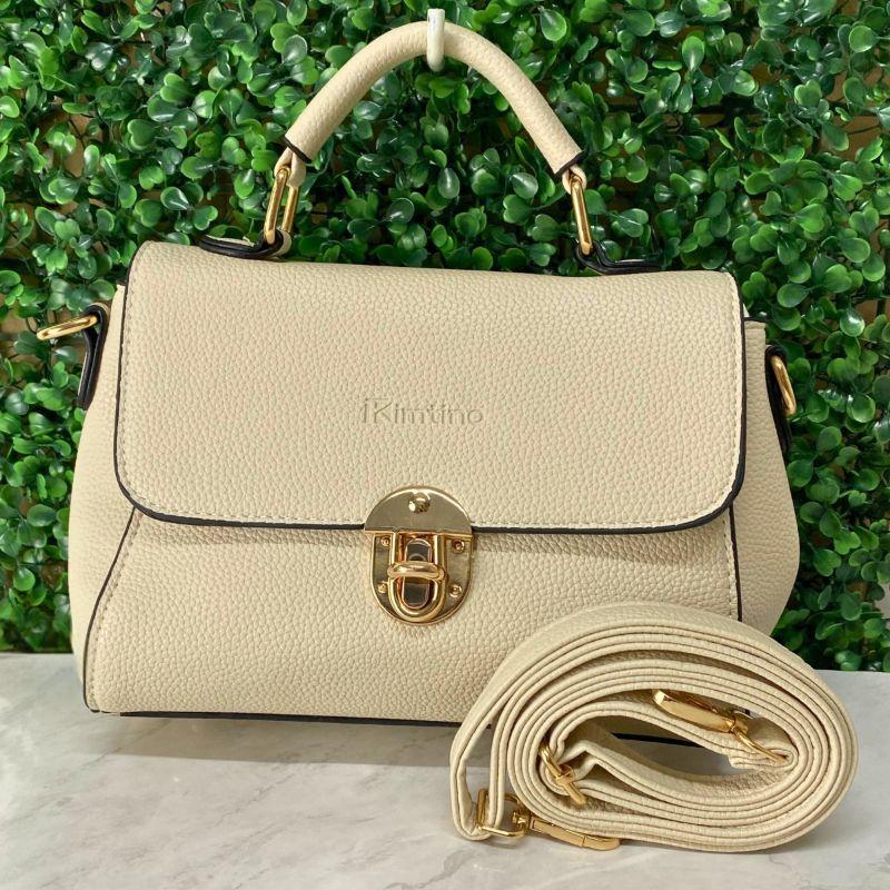 BOLSA PEQUENA QUADRADA LISA ABOTUADOR DE METAL